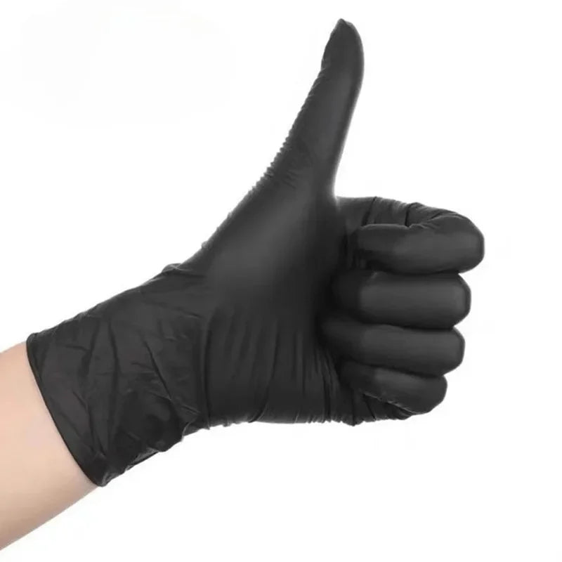 A hand wearing a black nitrile disposable glove making a thumbs up gesture.