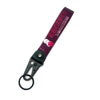 A dark purple keychain featuring an anime girl design with a steel clip.