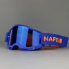 A pair of blue professional MX off-road goggles with an orange strap and a blue lens.