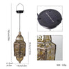 A hanging solar-powered Moroccan lantern with intricate waterproof ironwork design and a round solar panel top.