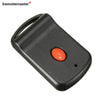 Black garage door remote control with an orange button and a loop for a key fob.