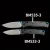 Two folding knives, BM535-3 and BM533-3, featuring black carbon fiber handles and silver blades.
