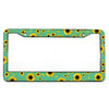A rectangular aluminum license plate frame with a green background featuring a pattern of yellow sunflowers.
