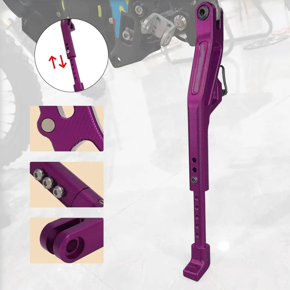 A close-up view of a purple CNC aluminum adjustable motorcycle kickstand for Sur Ron and Segway.