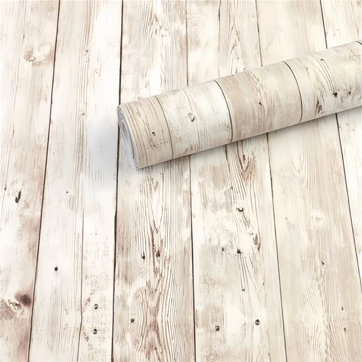 A roll of retro wood grain self-adhesive wallpaper lying on a light wooden floor.