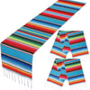 Vibrant Mexican Serape table runner featuring colorful stripes and decorative tassels