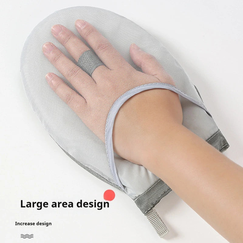 A hand is resting on a gray mesh ironing board glove, demonstrating a large area design.