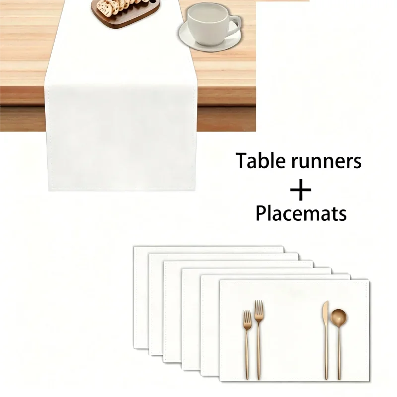 A set of white waterproof geometric table runners and placemats with gold cutlery displayed on a wooden table.