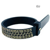 A black adjustable ring and bracelet sizer tool with a numbered scale on the inner surface.