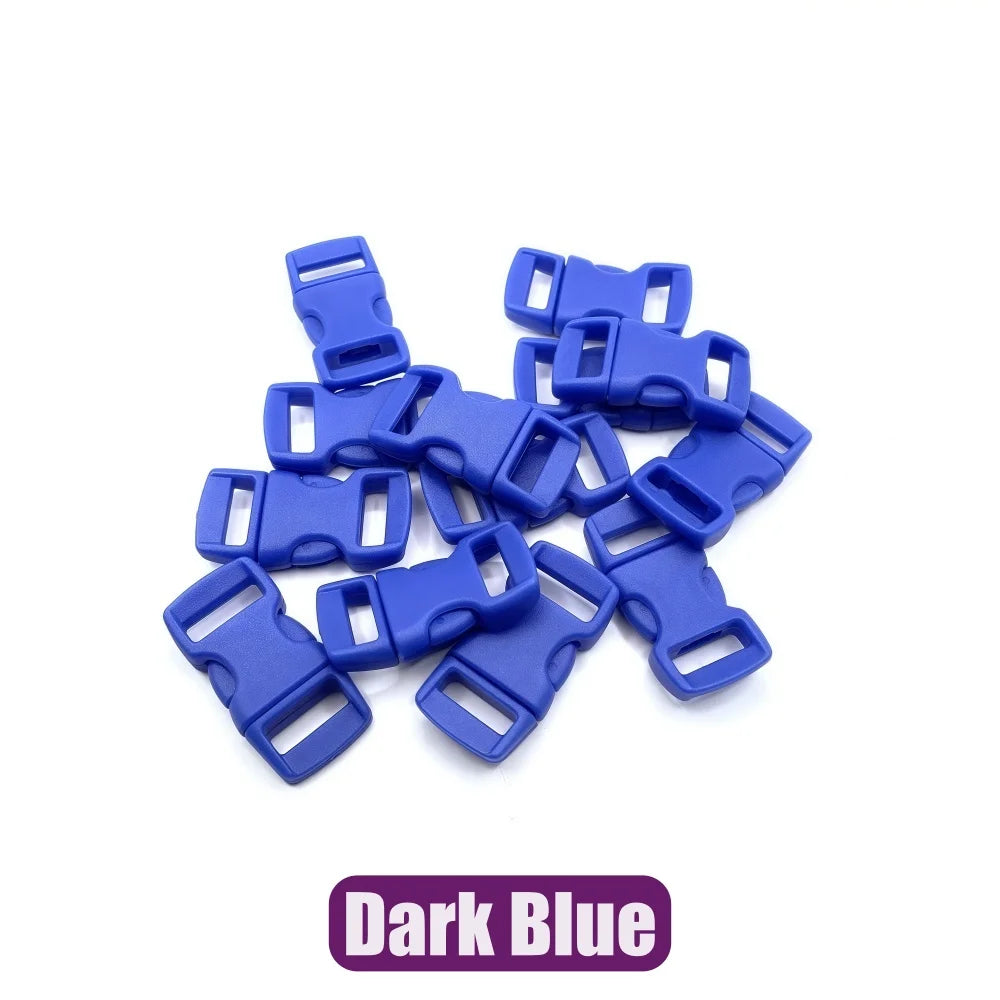 A pile of dark blue plastic side-release buckles for paracord bracelet projects.