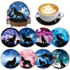 A set of DIY diamond painting coasters featuring silhouettes of wolves and other wildlife on a metal holder.