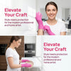 A woman wearing pink nitrile disposable gloves is shown working on a piece of glass.