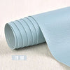 A roll of light blue self-adhesive PU leather patch for furniture and craft repairs.