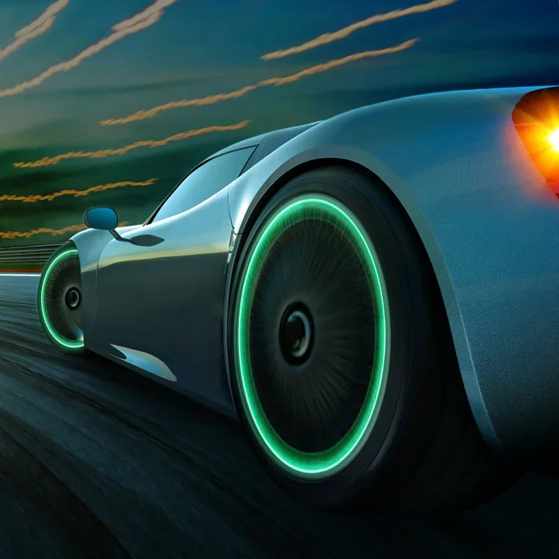 A silver sports car drives on a road with glowing green tire valve caps and a bright taillight at dusk.