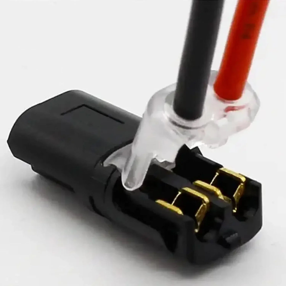 A black electrical connector with two pins, featuring a clear plastic housing and red and black wires.