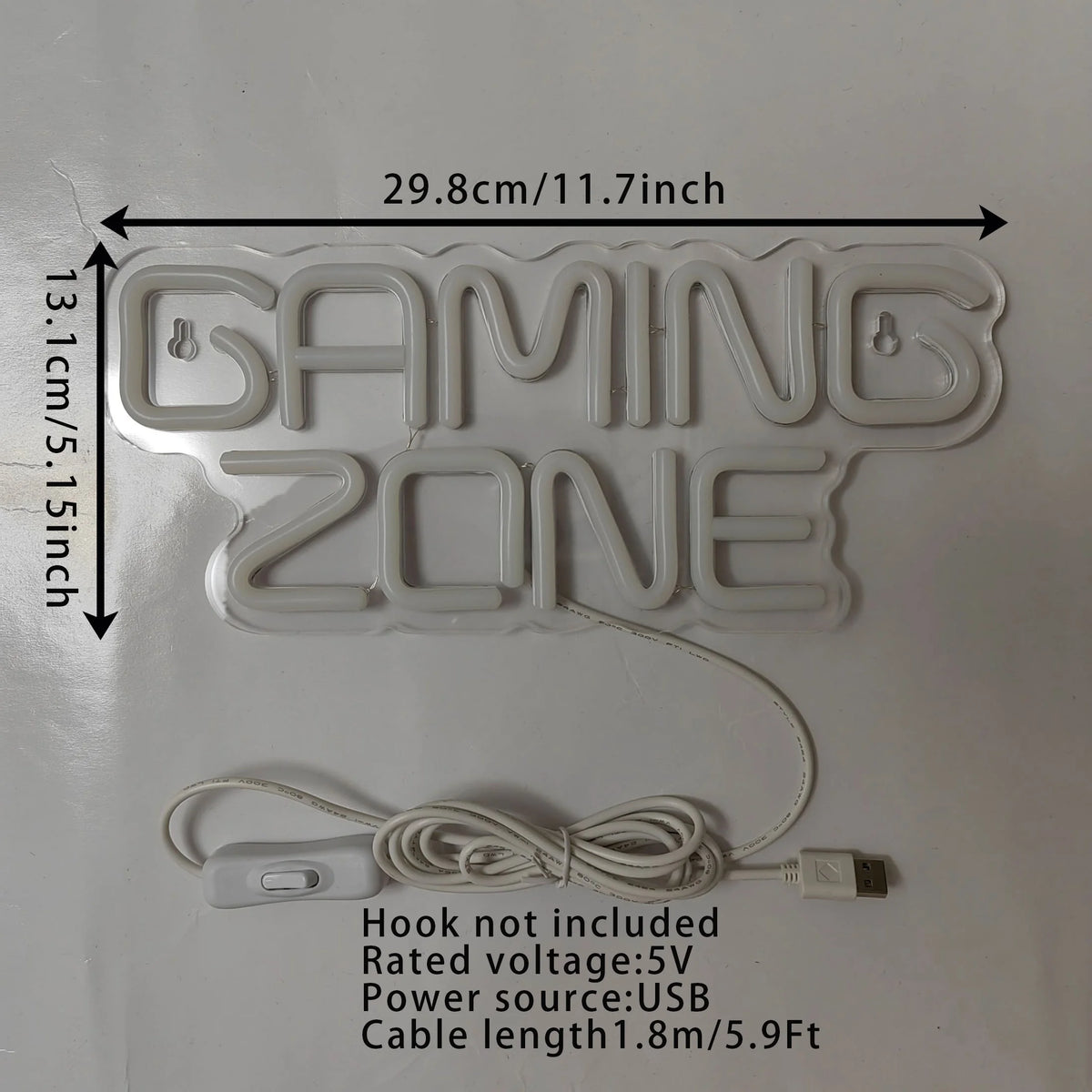 A white neon LED sign shaped like GAMING ZONE with dimensions 29.8cm by 13.1cm and a connecting wire.