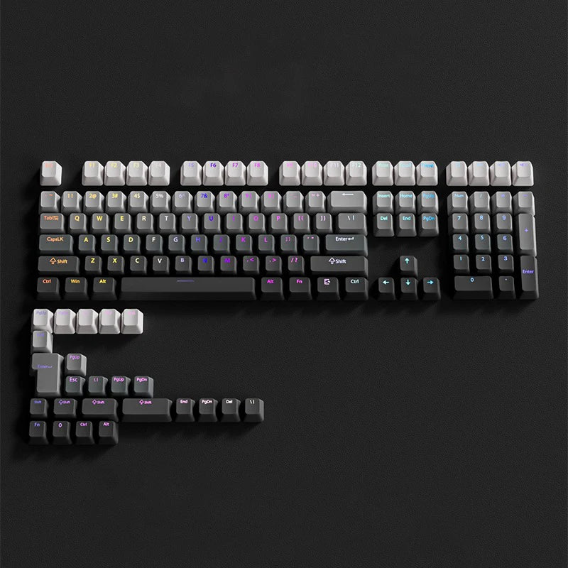 A close-up view of a black PBT double-shot keycap set with gradient colored keycaps on a dark background.