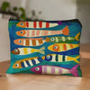 A cosmetic bag featuring a vintage sardine print design with various fish colors on a blue background.