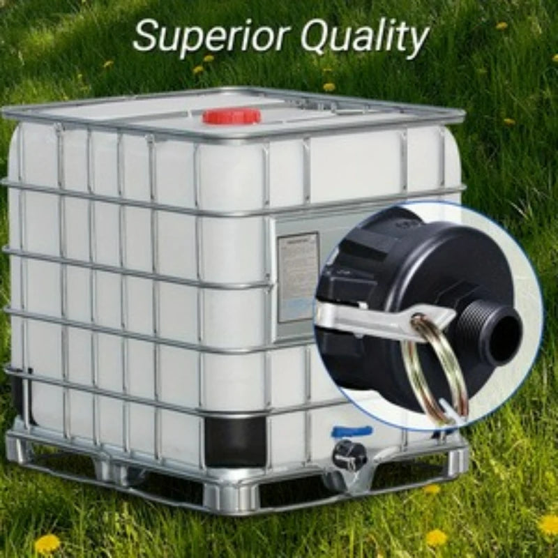 A white IBC tote drain adapter with a red cap and a black fitting is shown outdoors on green grass.