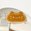 A golden caramel cat plush pencil case with a smiling face is shown on a white background.