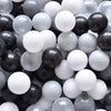 A pile of assorted gray and white ball pit balls for toddlers and kids.