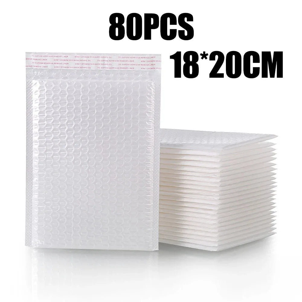 A stack of 80 pieces of white padded bubble mailers measuring 18x20cm.