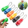 Various colored durable glove clips and a hand holding a green clip.