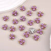 A collection of 20 purple pearlized resin flower beads for DIY jewelry and crafts.