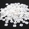 A pile of 100 white acrylic pearl spacer beads for jewelry making
