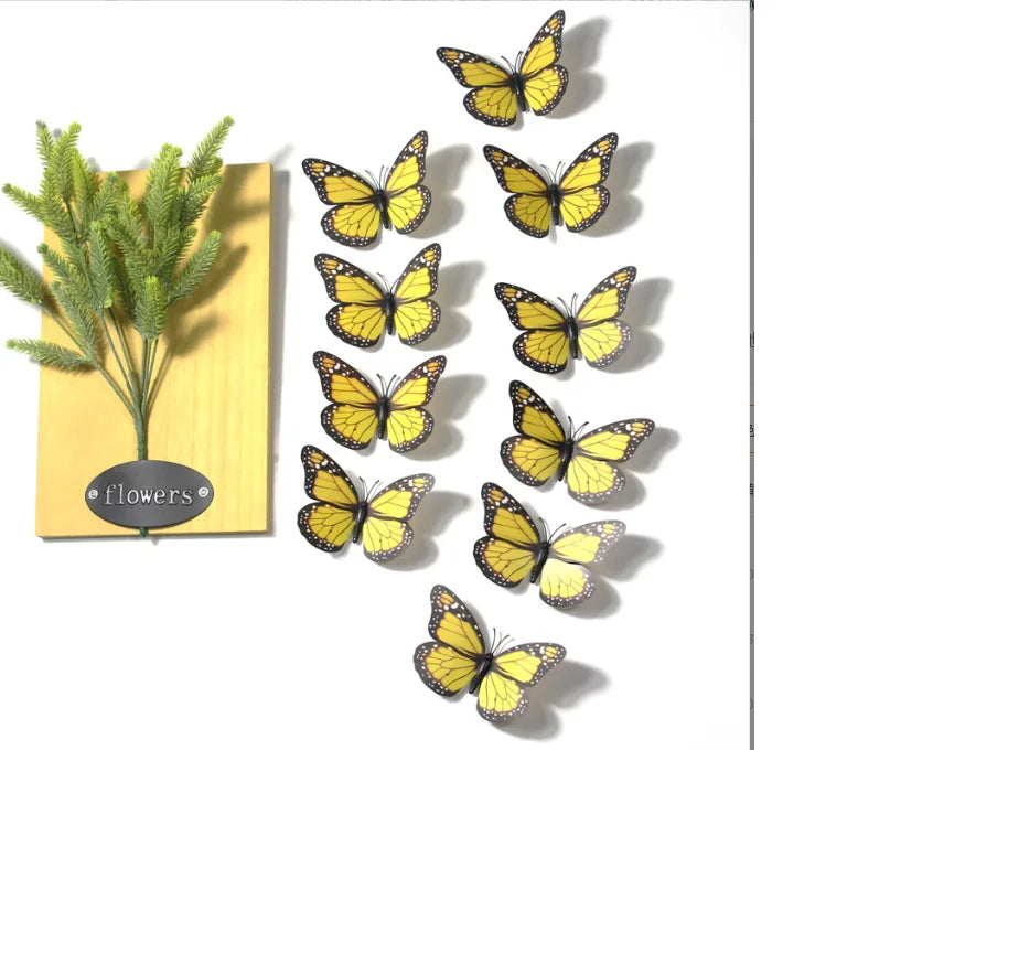 A collection of ten yellow and black monarch butterfly magnets arranged vertically on a white background.