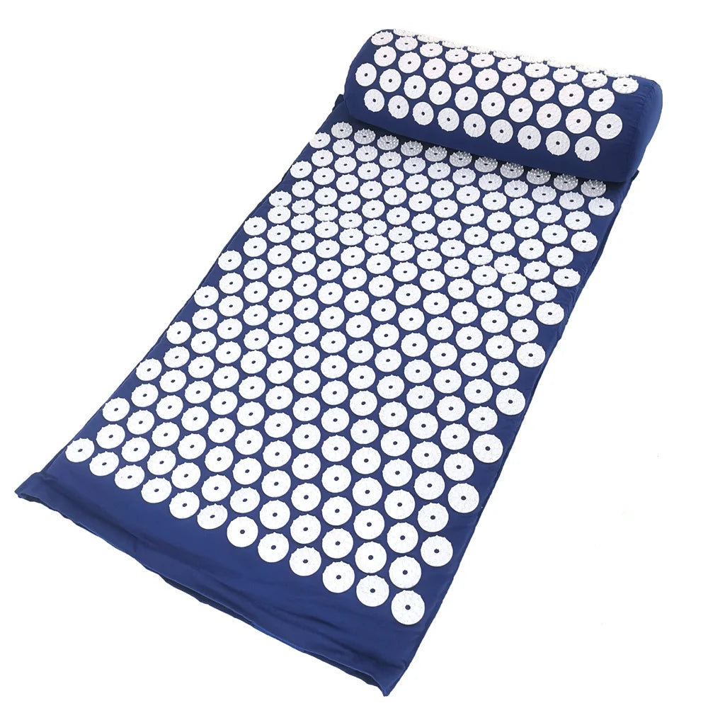 A dark blue acupressure mat and pillow set featuring a pattern of white, circular dots.