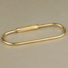 A brass gold keychain charm with a secure carabiner clip.