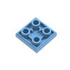 A pack of 2x2 reverse light panels for building blocks in a light blue color.