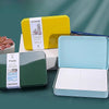 A set of three watercolor paper textures in yellow and light blue tin boxes.