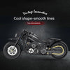 A detailed black vintage locomotive motorcycle model kit with smooth lines displayed against a dark background.