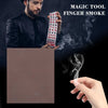 A man holds a deck of magic paper cards while smoke is generated in the background.