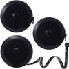 Black flexible soft tape measure with dual-sided markings and a coiled end.