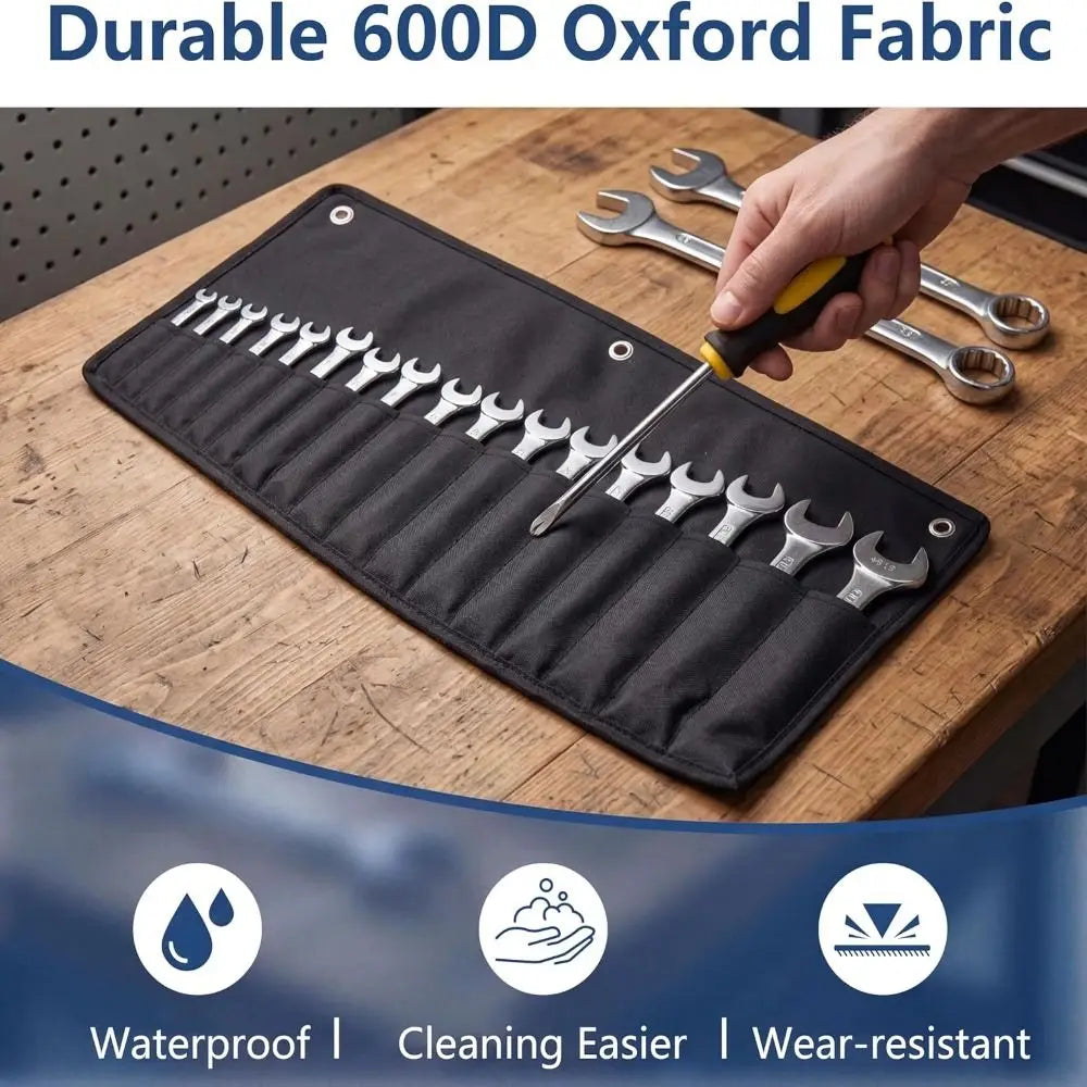 A black Oxford fabric tool bag with multiple pockets is shown on a wooden surface next to wrenches.
