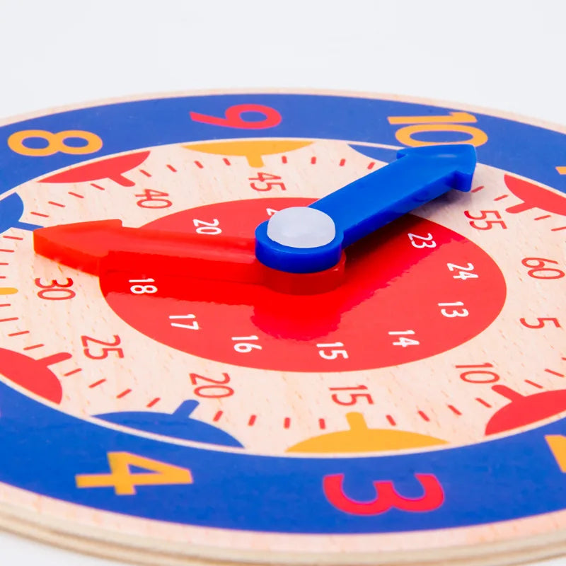 A wooden clock face with a blue hand pointing to the 10 o'clock position, used as a Montessori educational toy.