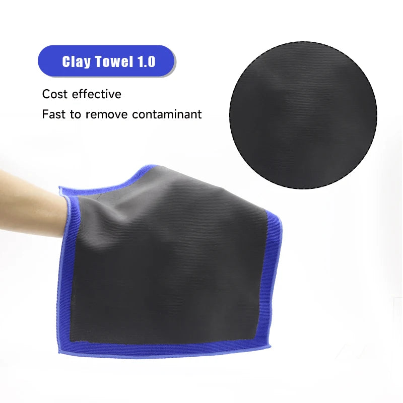 A black clay towel with a blue edge is shown next to a circular black cloth, used for car paint decontamination.