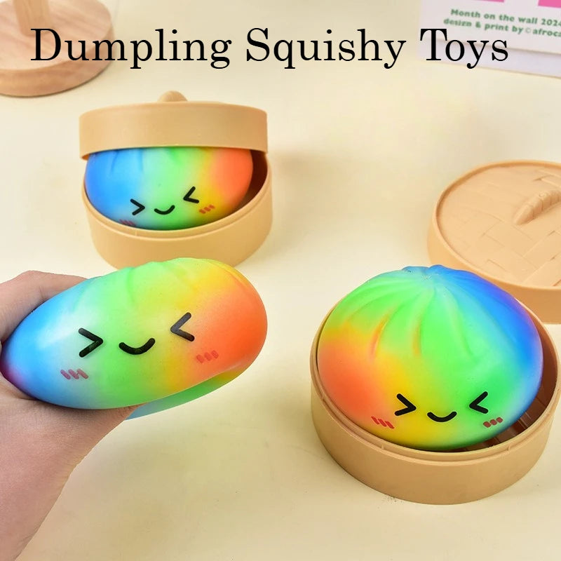 A hand holds a colorful rainbow dumpling squishy toy in its open packaging.