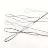 A collection of flexible stainless steel bead needles used for jewelry making
