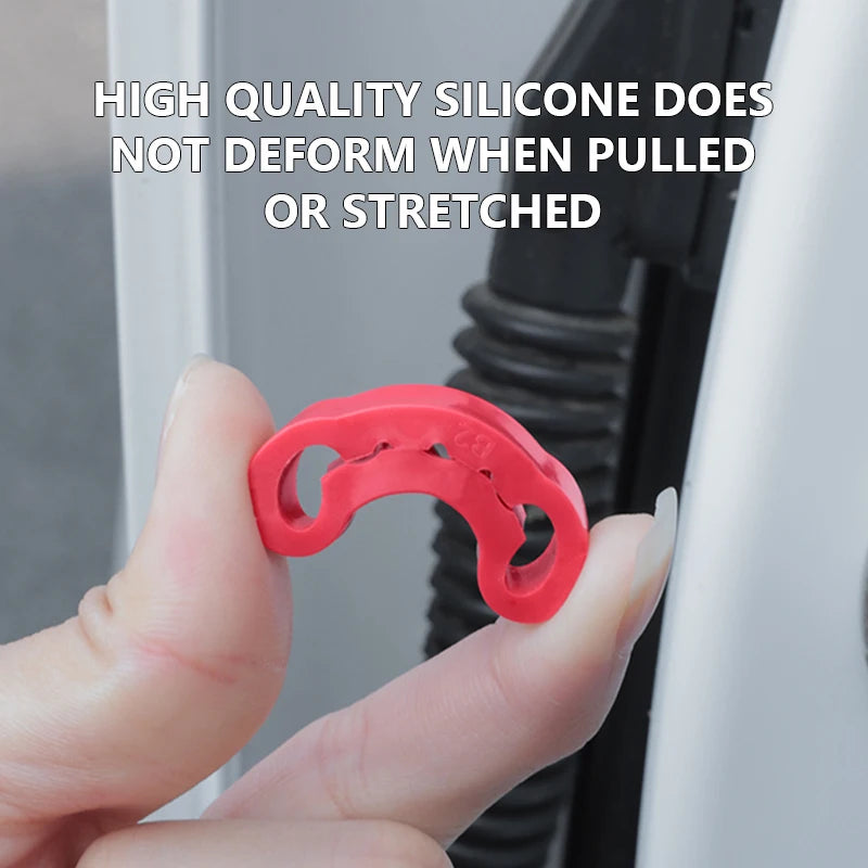 A hand holds a red silicone door shock-absorbing pad, demonstrating its flexibility and ability not to deform.