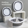 A set of white and gray folding washbasins displayed on a light surface.