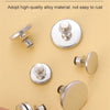 A collection of magnetic curtain clips in silver and gold tones shown against a light yellow background.