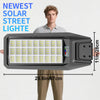 A man holds a newest solar street light, a rectangular outdoor security light with multiple LED panels.