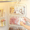 A white integrated laundry drying and storage rack featuring multiple hanging clips for socks and t-shirts.