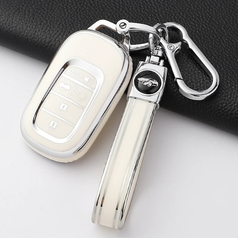 A clear silicone TPU protective case for a Honda key fob, attached to a metal keyring.