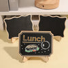 A wooden chalkboard sign shaped like a sandwich with the word Lunch written on it.