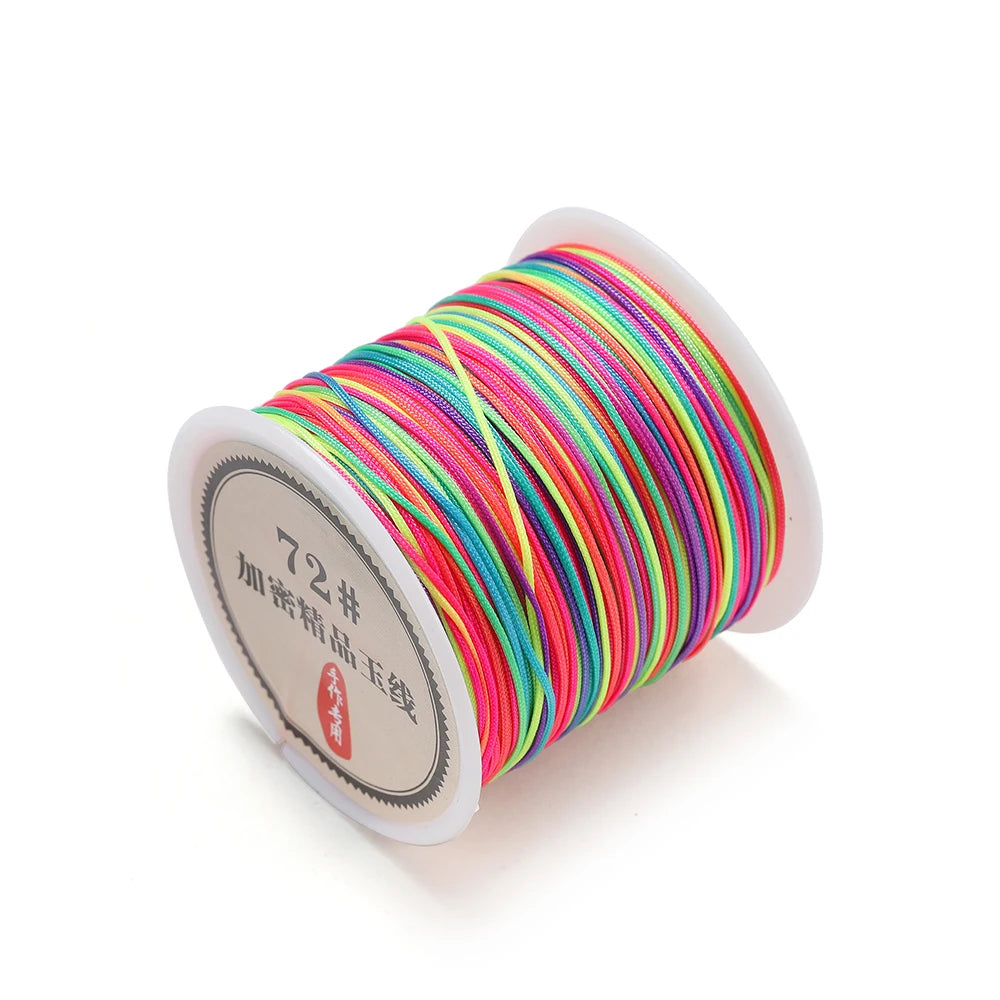 A spool of bright, multi-colored nylon macramé cord for jewelry making.